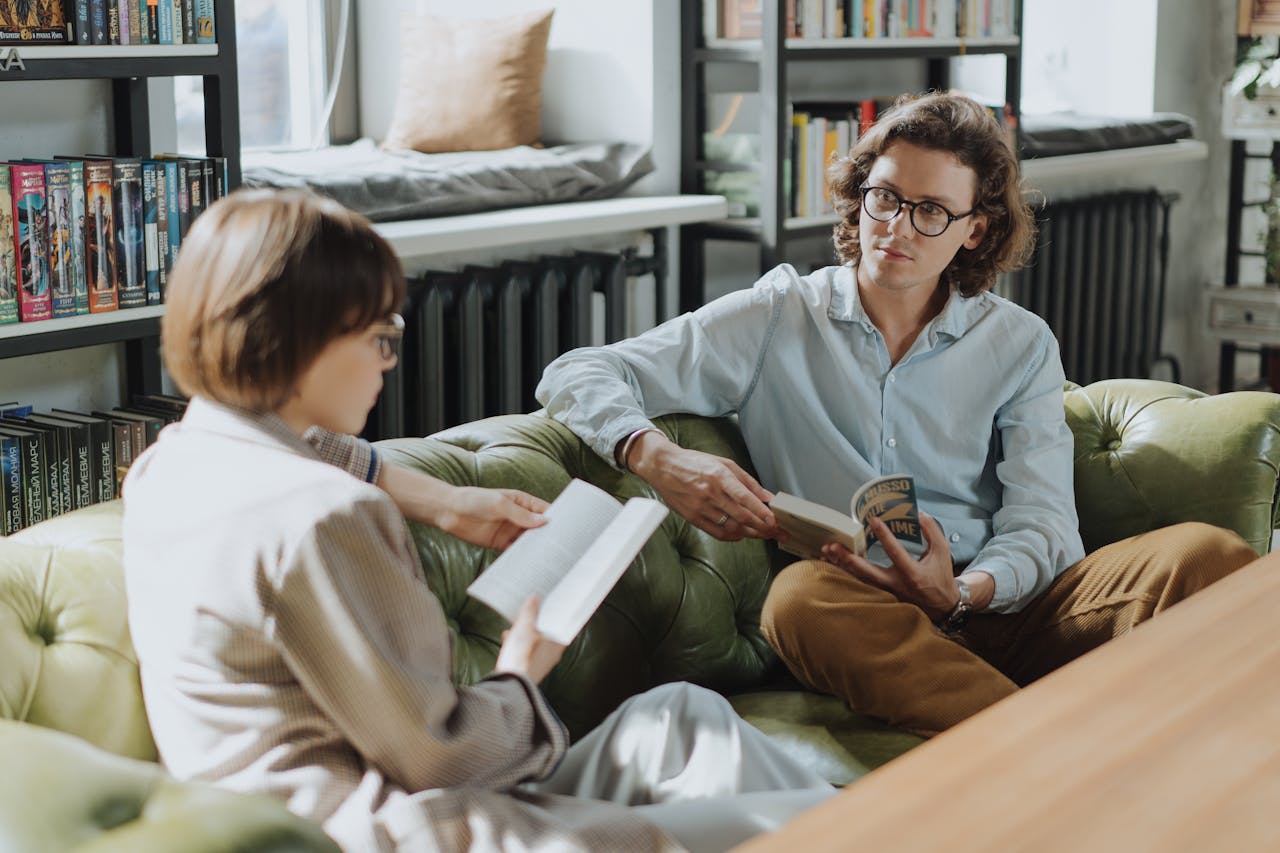 Woman in Gray Robe Reading Book